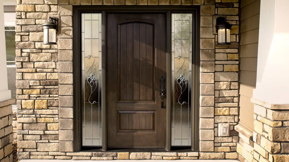 Front Doors Council Bluffs - A door with a window in a brick building - Window